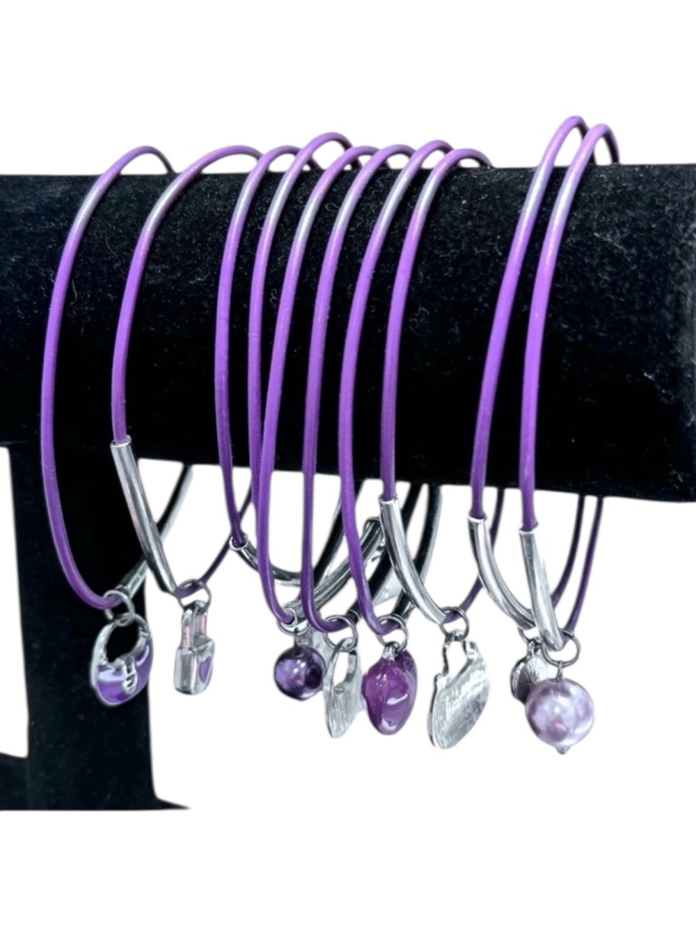 SET OF 10 PURPLE BRACELETS WITH SILVER TONE BARS AND CHARMS
